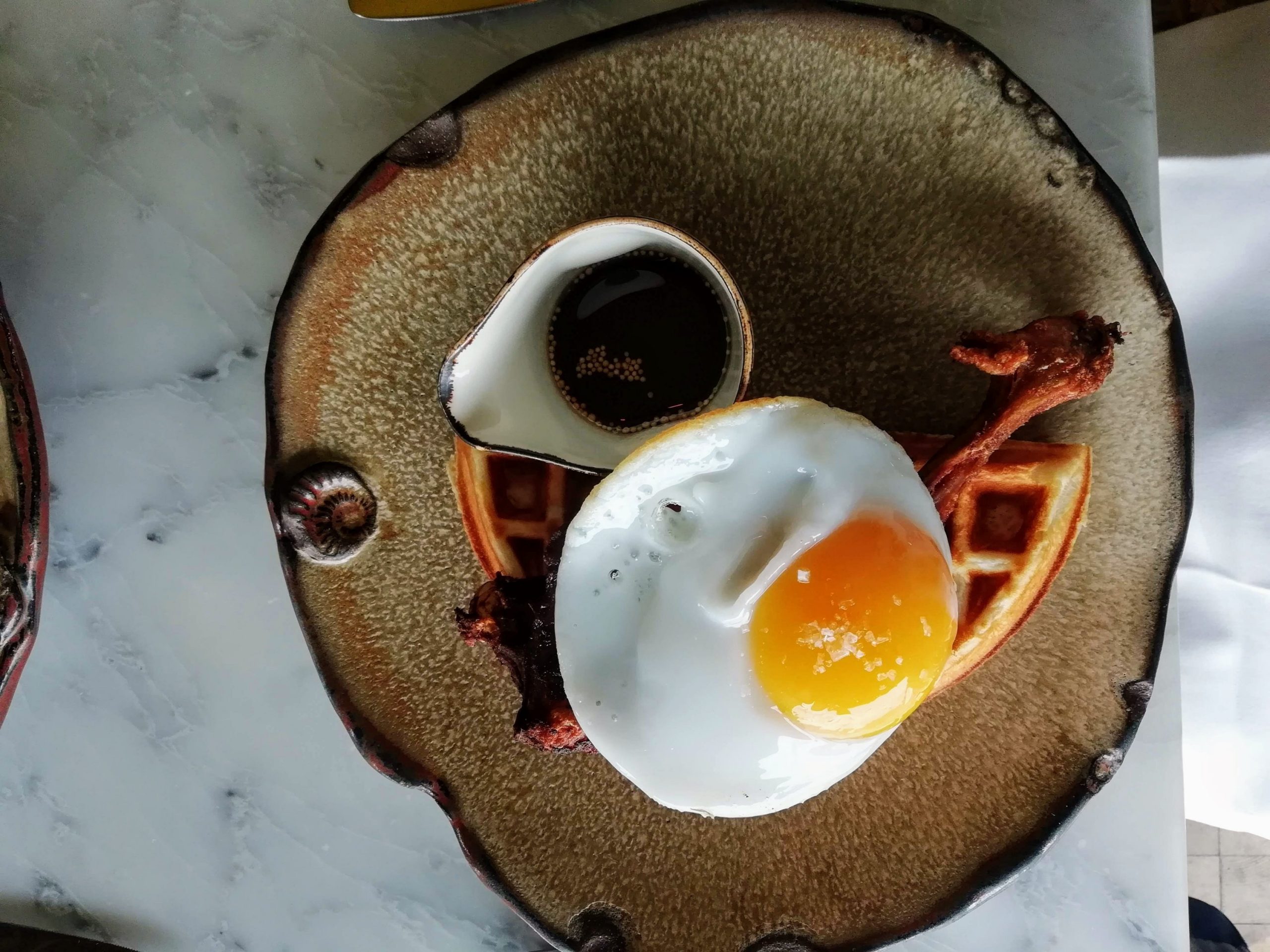 What Should I Order at Duck and Waffle? 1 Duck and Waffle confit duck, fried duck egg and mustard maple syrup