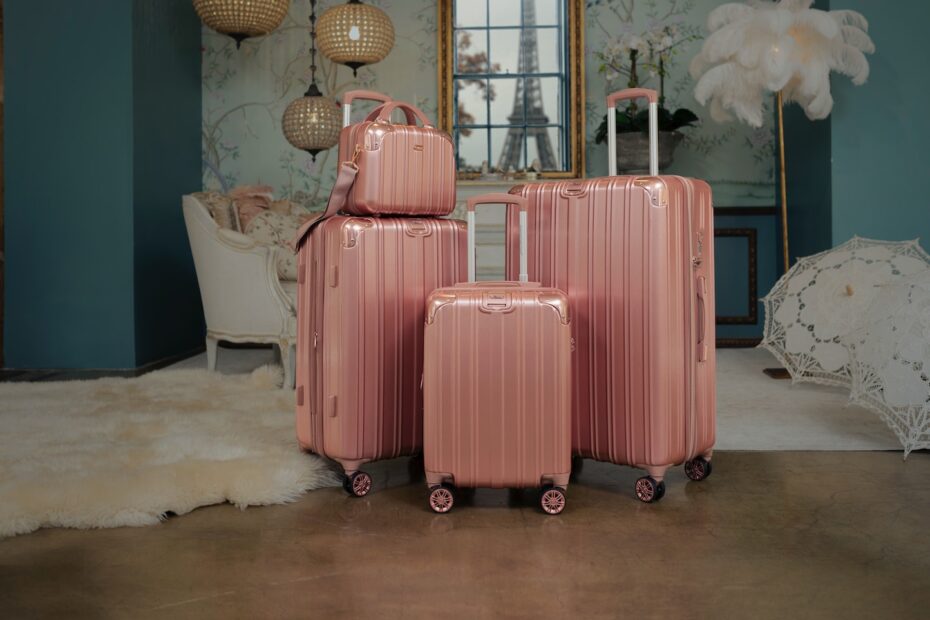 three pieces of pink luggage sitting in a room